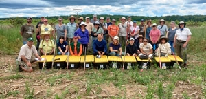 Peter Picone with volunteers planting one million native plant seeds